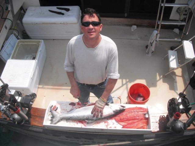 john_cleaningfishlookingup.jpg